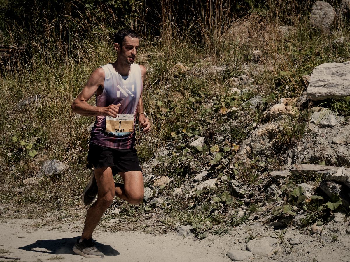 Kílian Jornet running a mountain trail race, wearing bib number one